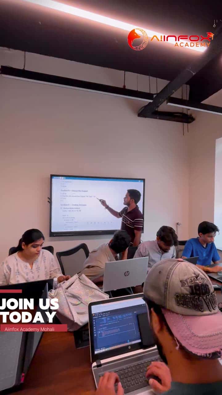 Students writing code on laptops during a class at Aiinfox Academy, Mohali