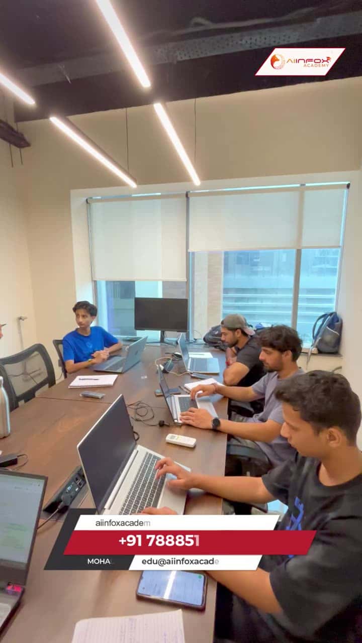 Trainer helping students with code at the Aiinfox Academy classroom in Mohali