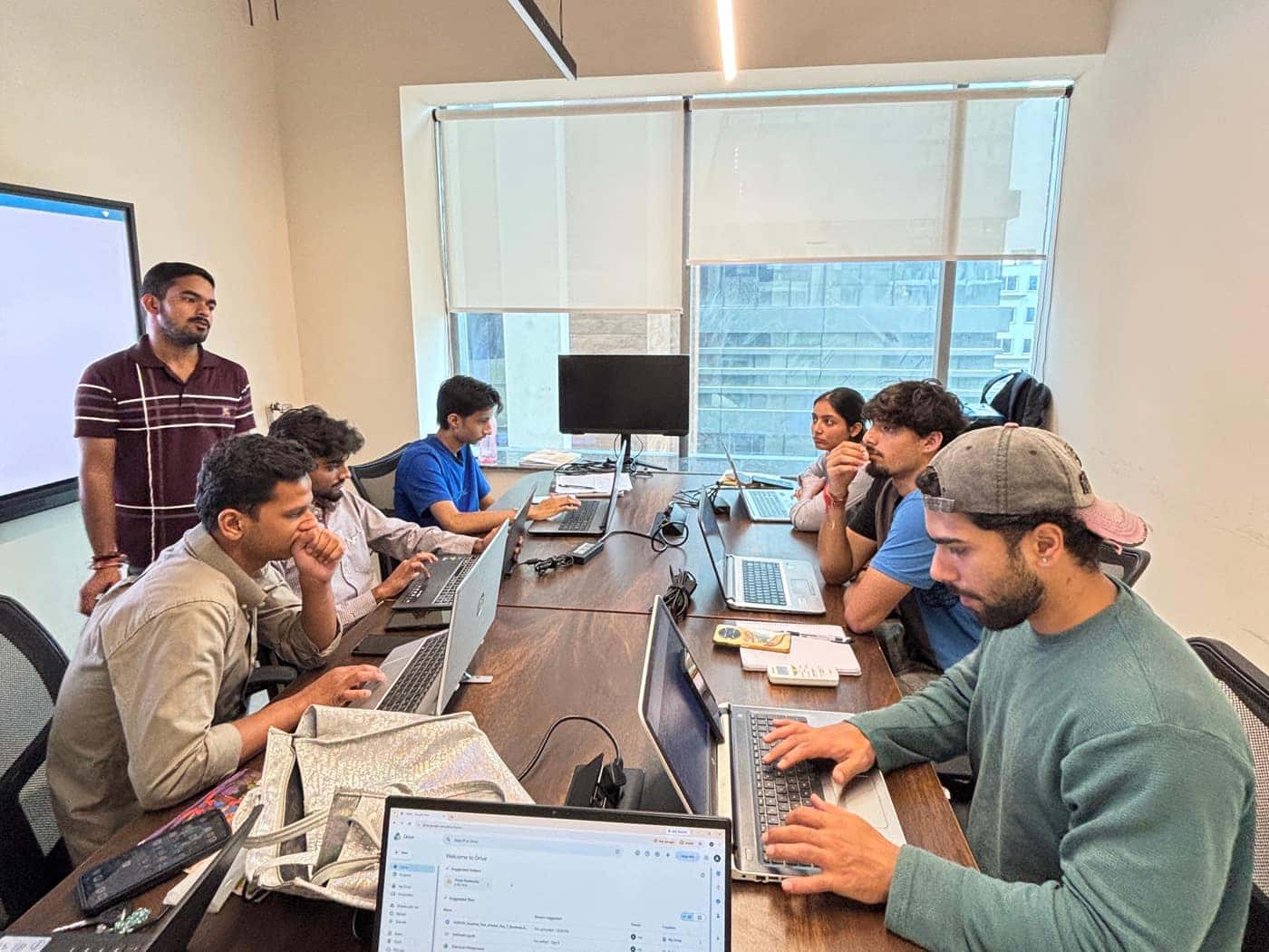 A class in progress at Aiinfox Academy, Sector 75, Mohali — students at laptops around the table with their trainer